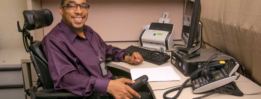 Man at desk using computer