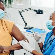 Man receiving covid-19 vaccine